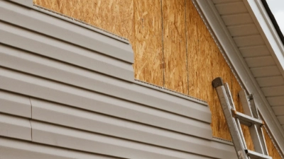 construction company installing siding on residential home in Austin